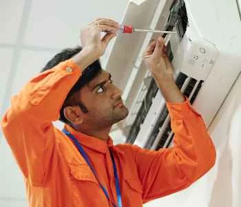 indian-man-setting-up-air-conditioner-RJ9VBA6_11zon